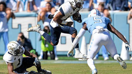 Patrice Rene (5) of the North Carolina Tar Heels looks to tackle Tobias Oliver of the Georgia Tech Yellow Jackets in the first half of their game at Kenan Stadium on November 3, 2018 in Chapel Hill, North Carolina.  (Photo by Grant Halverson/Getty Images)