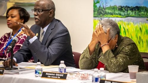 City Council Naeema Gilyard (R) reacts during a hearing to remove Mayor Bill Edwards and councilwoman Helen Zenobia Willis at the South Fulton City Hall, December 30, 2019. STEVE SCHAEFER / AJC FILE PHOTO