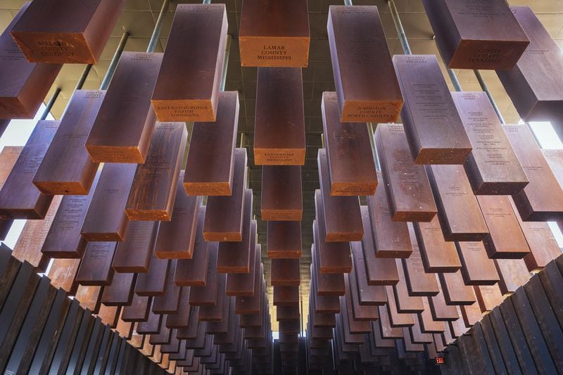 800 weathered steel columns, each one etched with the names of lynching victims, hang from the roof of the National Memorial for Peace and Justice in Montgomery. (Audra Melton/The New York Times)