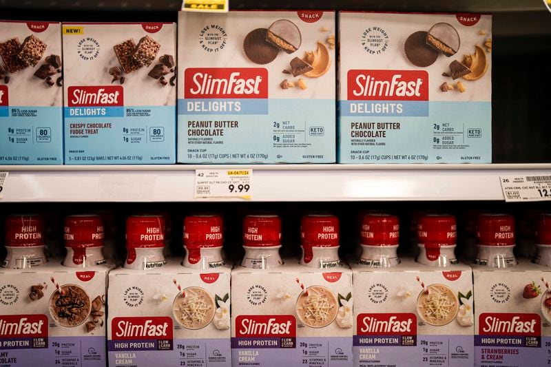 Slim Fast weight loss products are seen at a Kroger supermarket, Friday, April 12, 2024, in Marietta, Ga. Sales of SlimFast sold at supermarkets have dropped as people turn to weight loss drugs and retailers cut shelf space for diet products, the brand's parent company, Glanbia, told investors in February. (AP Photo/Mike Stewart)