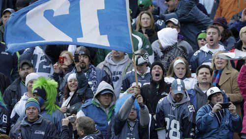 Seattle Seahawks fans are seen in the first half of an NFL NFC wild card playoff football game against the New Orleans Saints on Saturday, Jan. 8, 2011, in Seattle. (AP Photo/Elaine Thompson)