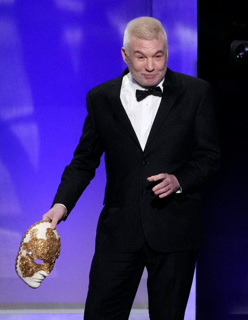 Actor Mike Myers holds a mask in reference to the 1999 film "Eyes Wide Shut" during the 49th AFI Life Achievement Award tribute to Nicole Kidman, Saturday, April 27, 2024, at the Dolby Theatre in Los Angeles. Kidman was one of the stars of the film, which was directed by the late Stanley Kubrick. (AP Photo/Chris Pizzello)