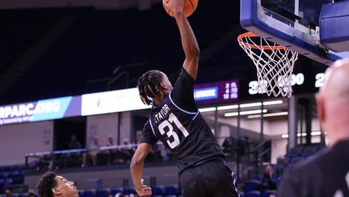 Georgia State's Lucas Taylor goes high for a one-handed dunk. Taylor scored 18 points in the 84-78 loss to James Madison on Feb. 27, 2024, at the GSU Convocation Center.