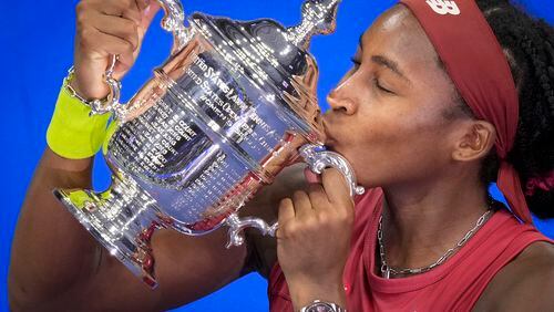 FILE - Coco Gauff, of the United States, poses for photographs after defeating Aryna Sabalenka, of Belarus, at the women's singles final of the U.S. Open tennis championships, Saturday, Sept. 9, 2023, in New York. (AP Photo/John Minchillo, File)
