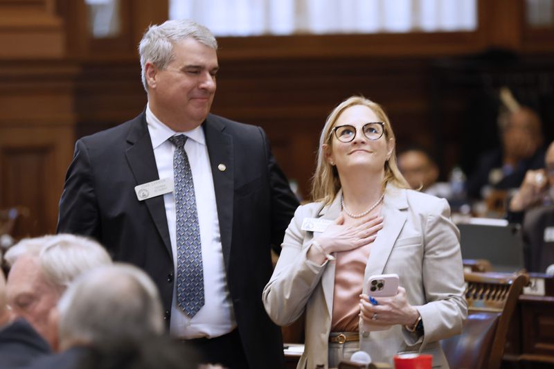 State Rep. Esther Panitch D-Sandy Springs, and State Rep. John Carson, R-Marietta, race as they celebrate the passing of the HB30 during Crossover Day at the Capitol in Atlanta on Monday, March 6, 2023. HB30 defines antisemitism so that it would be included under Georgia’s hate crimes law.
Miguel Martinez /miguel.martinezjimenez@ajc.com