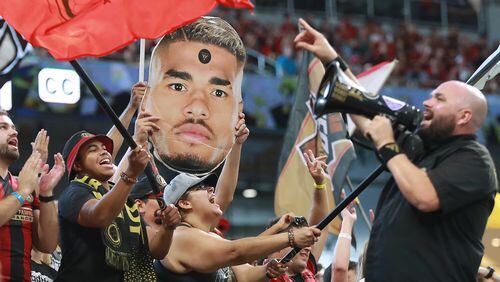 August 19, 2018 Atlanta: Atlanta United fans celebrate after forward Josef Martinez makes the MLS season record tieing goal, his 27th of the year, during a 3-1 victory over the Columbus Crew in a MLS soccer match on Sunday, August 19, 2018, in Atlanta.  Curtis Compton/ccompton@ajc.com