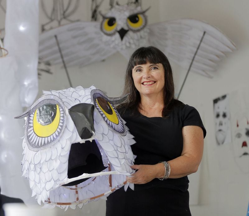 Chantelle Rytter created her latest parade -- a "parliament of owls" -- as a thank-you to Cousins Properties, who provided free studio space in their Midtown skyscraper, the Promenade II. BOB ANDRES  /BANDRES@AJC.COM