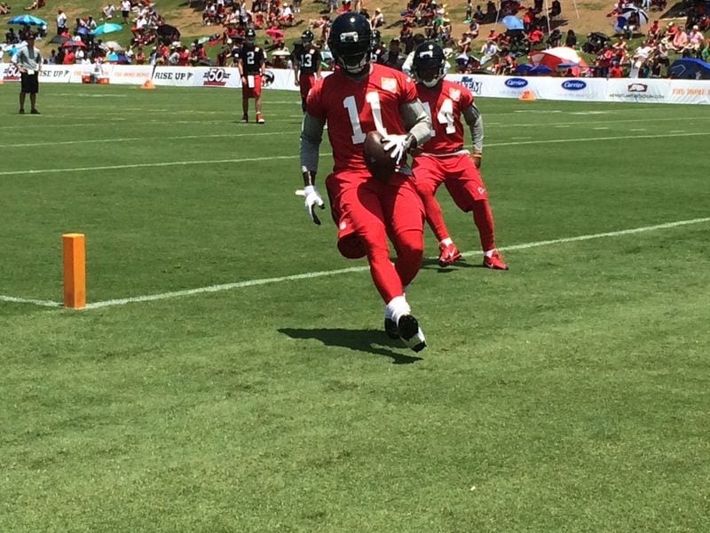 Julio Jones after making a catch on a fade route in minicamp practice on Wednesday, June 17, 2015. (D. Orlando Ledbetter/AJC).