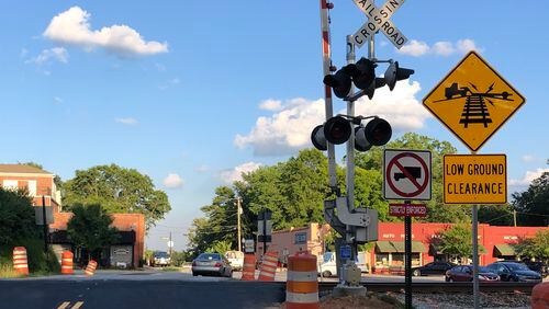 Improvements to the Holcomb Bridge Road at Thrasher Street intersection in Norcross are near completion and traffic over the railroad tracks has reopened. (Photo by Karen Huppertz)