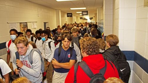 Effingham County High School students are shown changing classes, in a crowded hallway, on Aug. 5, 2020, the first day of school. Masks are not required for students in Effingham County, but are strongly recommended.  Rick Lott for SavannahNow.com