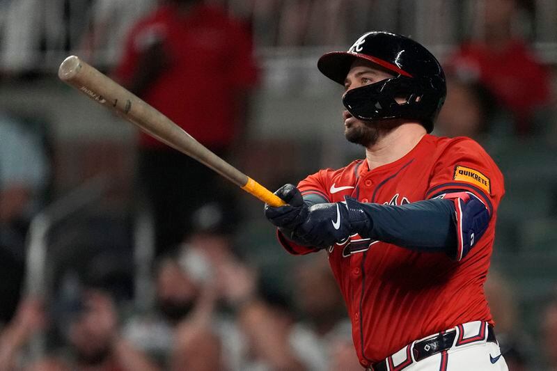 Atlanta Braves' Travis d'Arnaud hits a grand slam in the sixth inning of a baseball game against the Texas Rangers Friday, April 19, 2024, in Atlanta.The home run was d'Arnaud's third of the game. (AP Photo/John Bazemore)