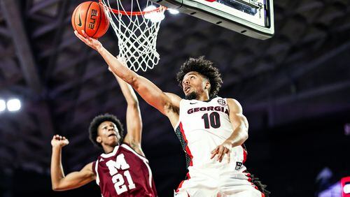 Georgia basketball player Aaron Cook (10), a transfer from Gonzaga, scores on a layup against Morehouse during an exhibition game at Stegeman Coliseum in Athens on Friday, Nov. 3, 2021. (Photo by Tony Walsh/UGA Athletics)