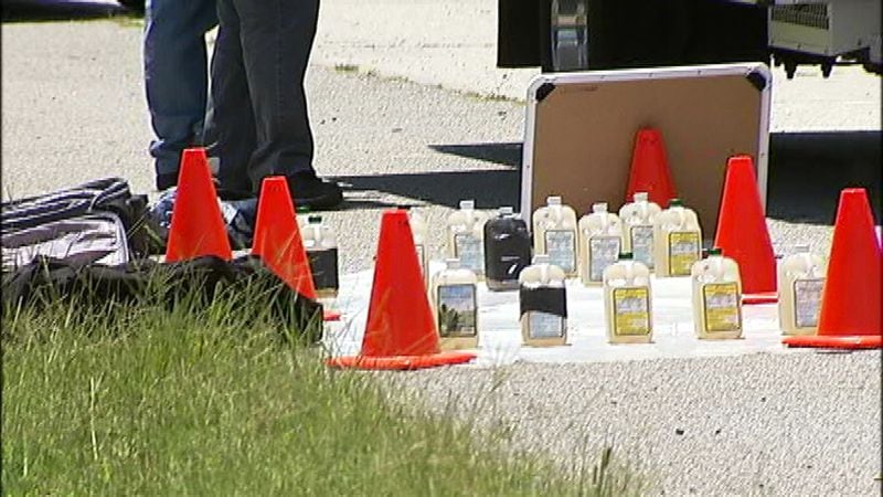 The Drug Enforcement Administration recovered four gallons of liquid methamphetamine on I-85 near the airport Wednesday. (Credit: Channel 2 Action News)