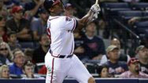Justin Upton follows through on his game-tying homer off Tyler Clippard on Friday.