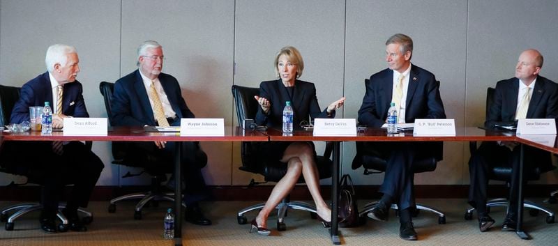  Dean Alford (from left), State Board of Regents, Wayne Johnson, Department of Education, Betsy DeVos, U.S. Education Department Secretary , G. P. "Bud" Peterson, Georgia Tech President, and Dene Sheheane, Georgia Tech Vice President, take part in the meeting. DeVos made a stop at Georgia Tech on Wednesday where she meet with students to learn about Tech's efforts to rethink college education and to promote a new mobile FAFSA app that's touted to streamline the financial aid application process. Johnson is making a bid for the U.S. Senate. 