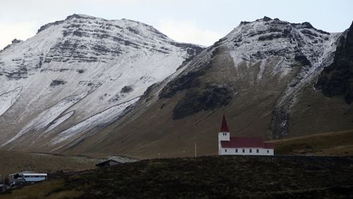 FILE - In this Oct. 26, 2016 file photo, the church of Vik, Iceland, near the Volcano Katla, After a summer of increased seismic activity at Katla, Icelanders are obsessing over the smallest sign of an eruption at the countryâs most closely watched volcano. Katla last erupted in 1918. Never before in recorded history, dating back to the 12th century, have 99 years passed without an eruption from the volcano. (AP Photo/Frank Augstein, File)
