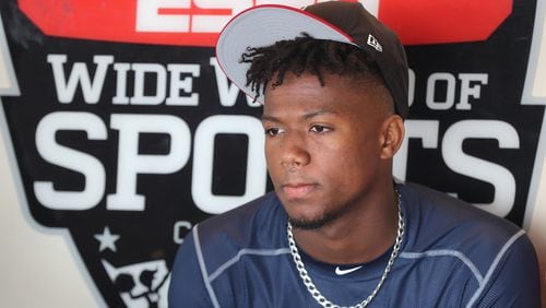 Braves outfielder Ronald Acuna, rated the consensus No. 1 prospect in baseball this winter by several experts, takes questions from the media during an interview in the dugout on Thursday, Feb 15, 2018, at Champion Stadium in Lake Buena Vista.  Curtis Compton/ccompton@ajc.com