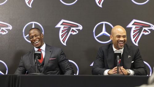 Falcons coach Raheem Morris and general manager Terry Fontenot share a laugh while responding to a question during Monday's introductory press conference.