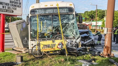 A MARTA bus with significant front-end damage and a crumpled passenger car were involved in the wreck on Ga. 85.