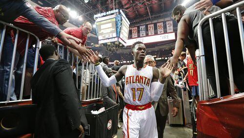 Hawks’ Dennis Schroder celebrates a 116-98 victory over the Wizards with fans in Game 3 of a first-round NBA basketball playoff series on Saturday, April 22, 2017, in Atlanta. Curtis Compton/ccompton@ajc.com