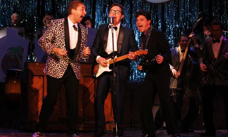 Jeremy Aggers (center, flanked by Ethan Ray Parker, left, as the Big Bopper and Ricardo Aponte as Ritchie Valens) plays and sings the title role in “Buddy: The Buddy Holly Story” at Georgia Ensemble Theatre. CONTRIBUTED BY DAN CARMODY / STUDIO7