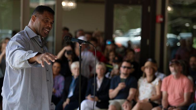 Republican Senate canididate Herschel Walker speaks to supporters during a campaign stop, Saturday, May 14, 2022, in Ellijay, Ga. (AP Photo/Mike Stewart, Pool)