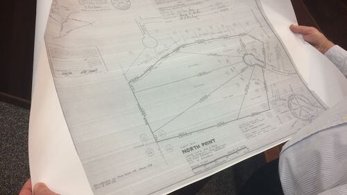 Mike Hartley, North Point resident, pointed to property plans from 1979 at a Roswell Planning  Commission meeting. He opposes a proposed development in the neighborhood.