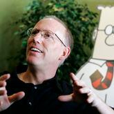 Scott Adams, creator of the comic strip "Dilbert," talks about his work in his studio in Dublin, Calif., in 2006. (AP Photo/Marcio Jose Sanchez)