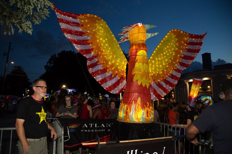 Volunteer Greg Martin looks out for one of the large lanterns before the start of the Atlanta BeltLine Lantern Parade Saturday, September 22, 2018. STEVE SCHAEFER/SPECIAL TO THE AJC