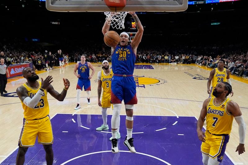 Denver Nuggets forward Aaron Gordon (50) dunks during the second half of Game 3 of an NBA basketball first-round playoff series against the Los Angeles Lakers in Los Angeles, Thursday, April 25, 2024. (AP Photo/Ashley Landis)