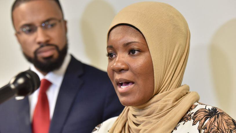 Jalanda Calhoun, a female Muslim correctional officer, filed a complaint with the Georgia Commission on Equal Opportunity, alleging prison officials in Reidsville will not let her wear the hijab. Calhoun is with Edward Ahmed Mitchell, attorney and executive director at CAIR-Georgia, during a news conference in Atlanta on Wednesday. HYOSUB SHIN / HSHIN@AJC.COM