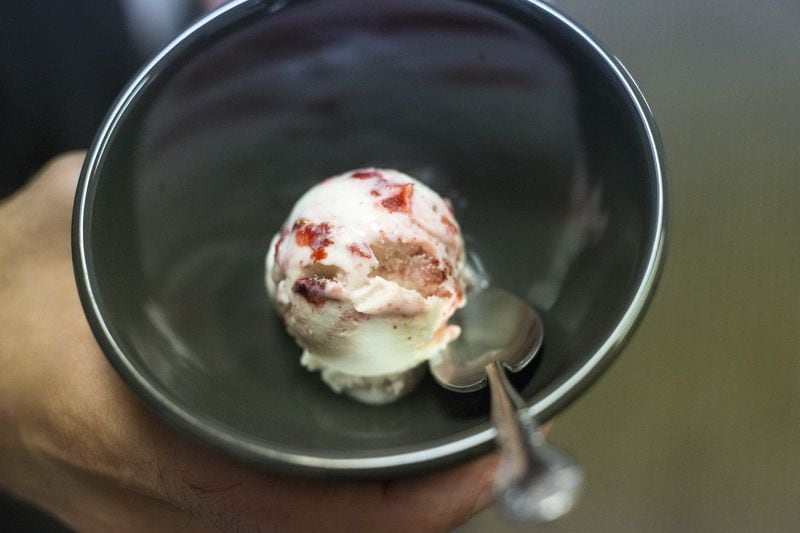 A scoop of Fresh Strawberry Malai is prepared for tasting at the Icecream Walla packaging and distribution facility in Stone Mountain. ALYSSA POINTER/ALYSSA.POINTER@AJC.COM