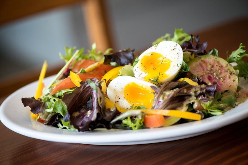 Manny's Mixed Green Salad with mixed herbs, seasonal vegetables and a 7 minute egg. Photo credit- Mia Yakel.