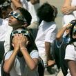 Woodward Elementary School in Atlanta held an eclipse viewing party in 2017, as the entire school dressed in white and watched the event with solar eclipse glasses. Some metro Atlanta schools are hosting events for the eclipse on April 8, 2024. (Bob Andres  / AJC file photo)