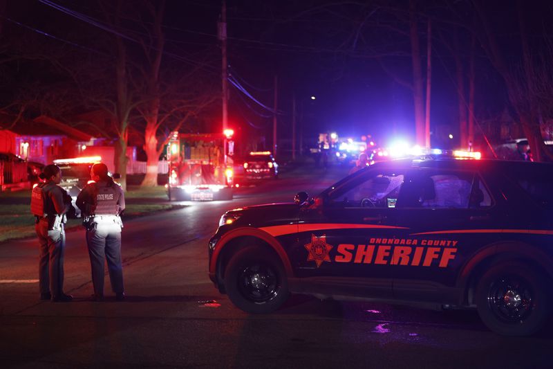 Police set up a perimeter after two officers were shot, in Salina, N.Y., Sunday, April 14, 2024. (Scott Schild/The Post-Standard via AP)