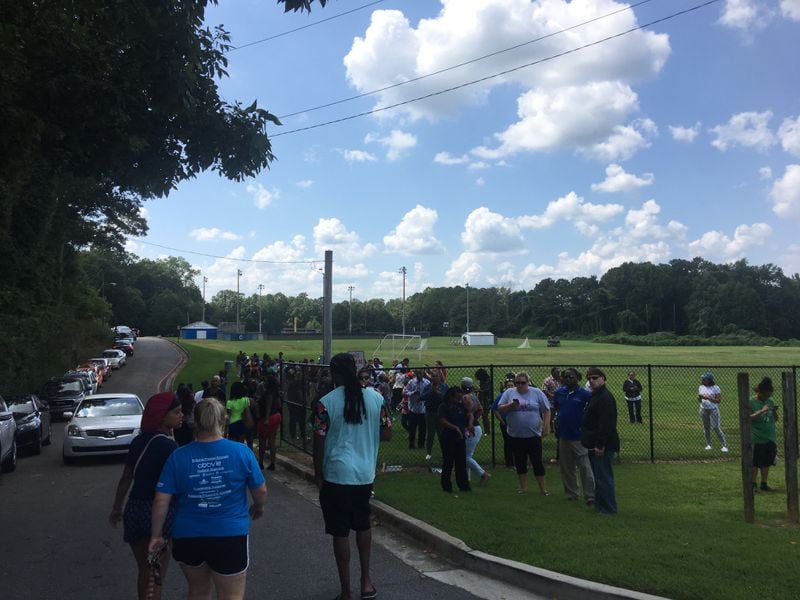 Parents picked up their children at a nearby soccer field after the lockdown. LAUREN COLLEY / LAUREN.COLLEY@AJC.COM