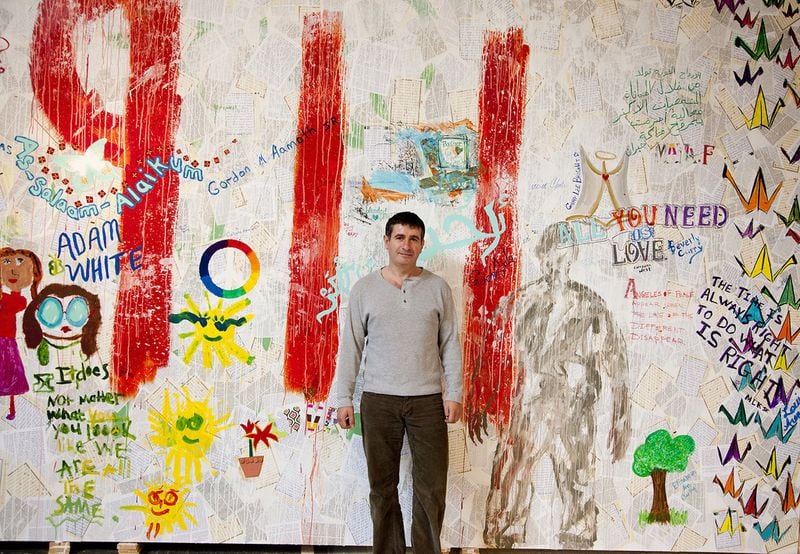 Atlanta-based artist and author Nabil Mousa stands in front of one of his projects. CONTRIBUTED