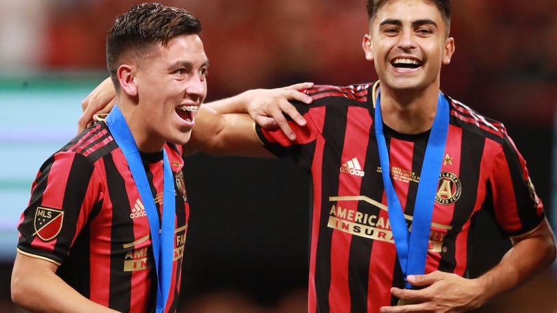 August 27, 2019 Atlanta: Atlanta United players Ezequiel Barco (left) and Pity Martinez celebrate beating Minnesota United 2-1 to win the U.S. Open Cup on Tuesday, August 27, 2019, in Atlanta.  Curtis Compton/ccompton@ajc.com