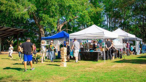 “Art on the Green” is one of many events held at the Elm Street Cultural Arts Village in downtown Woodstock. The City Council has approved spending $28,000 to have a consultant draw up bid documents to construct a playground there. ELM STREET CULTURAL ARTS VILLAGE via Facebook