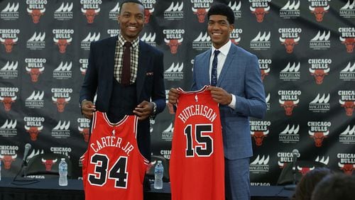 Bulls draft picks Wendell Carter Jr., left, and Chandler Hutchison pose with their jerseys on Monday, June 25, 2018, at the Advocate Center in Chicago. (Antonio Perez / Chicago Tribune/TNS)