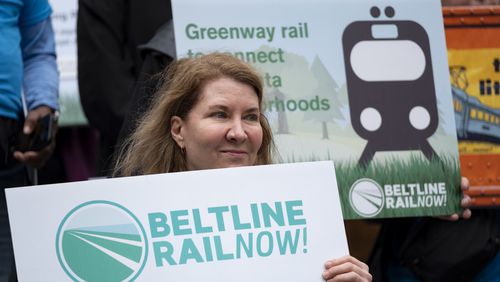 Advocates for Beltline rail, including Beverly Miller, who is on the board of Beltline Rail Now!, rally on the steps of Atlanta City Hall on Friday, March 22, 2024.   (Ben Gray / Ben@BenGray.com)