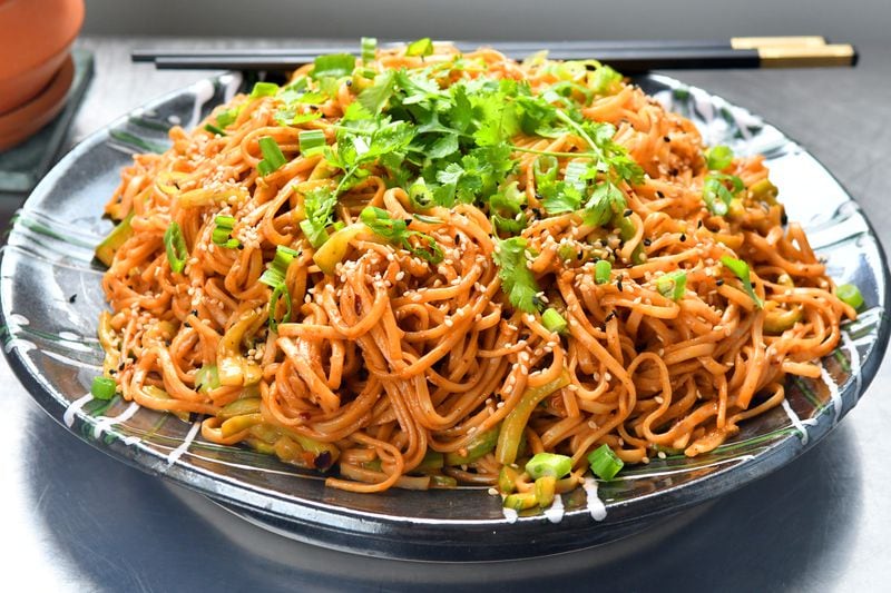 Restaurant-style Chilled Sesame Noodles, adapted from a recipe by Jing Gao, can be made with any noodles including spaghetti.
(Styling by Wendell Brock. Chris Hunt for The Atlanta Journal-Constitution)