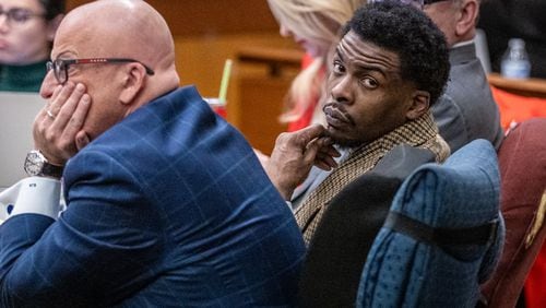 Deamonte Kendrick sits with his attorneys Monday morning ahead of opening statements in the YSL trial at Fulton County Courthouse on Monday, Nov. 27, 2023. (Steve Schaefer/steve.schaefer@ajc.com).