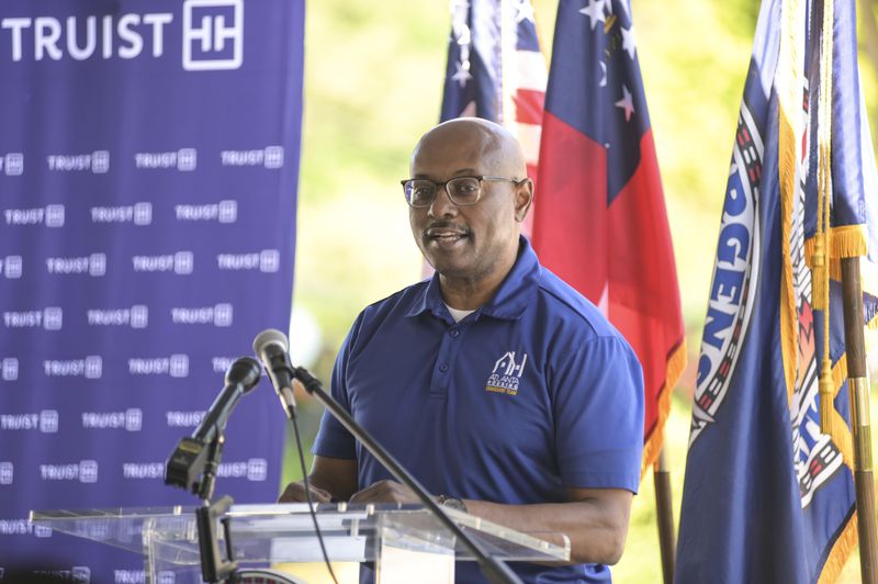 Atlanta Housing Authority CEO Eugene Jones Jr. speaks during the ribbon cutting ceremony for the Villages of East Lake grand reopening on Monday, May 9, 2022. (Natrice Miller / natrice.miller@ajc.com)