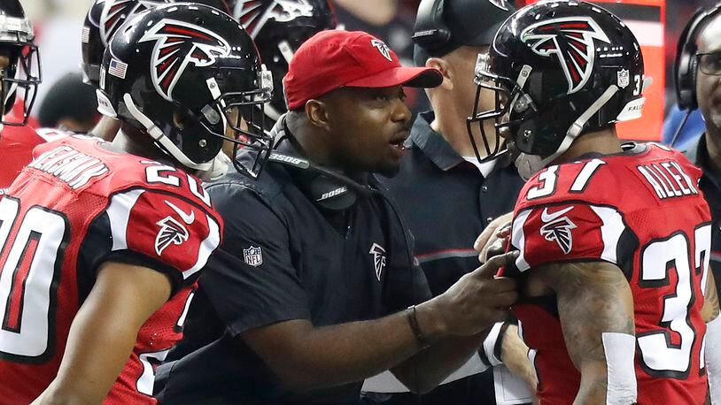Atlanta Falcons secondary coach Marquand Manuel talks to safety Ricardo Allen (37) during an NFC Championship game against the Green Bay Packers Sunday, Jan. 22, 2017.
