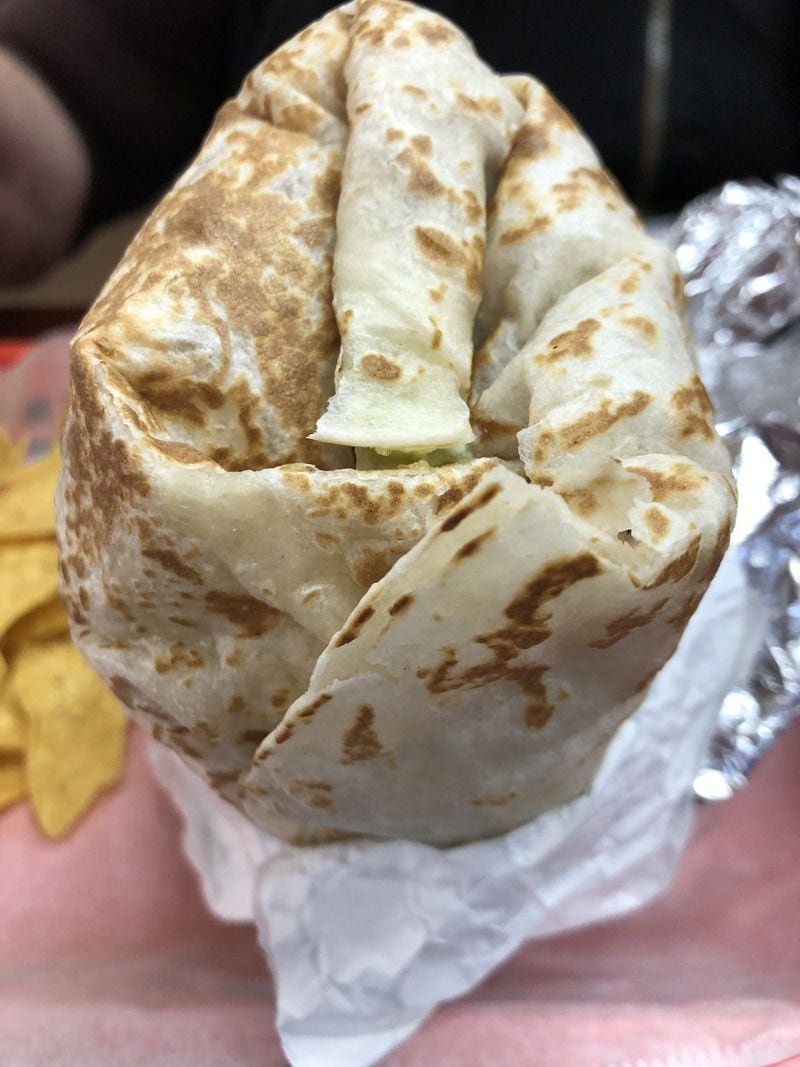 We dare you to finish one of the two-fisted burritos at Don Burrito. This one is crammed with lengua and all the toppings. CONTRIBUTED BY WENDELL BROCK