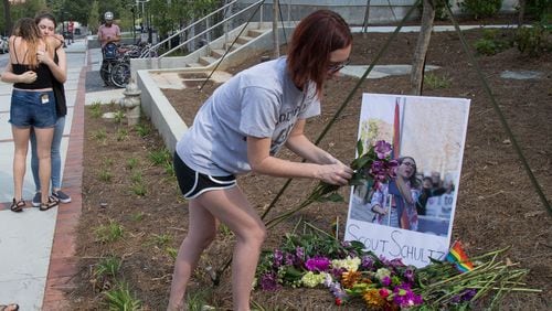 Morner set out flowers at a memorial for Georgia Tech student Scout Schultz Sunday, September 17, 2017, In Atlanta GA.  Schultz, an engineering student at Georgia Tech, was shot by Georgia Tech campus police near Curran Parking Deck after allegedly wielding a knife and telling officers to shoot him Saturday night.  STEVE SCHAEFER / SPECIAL TO THE AJC
