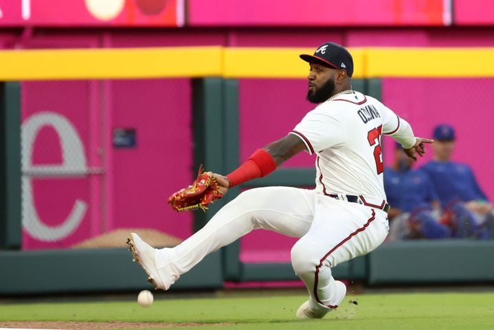 Atlanta Braves left fielder Marcell Ozuna (20) cannot catch a fly during the third inning of a baseball game on Wednesday, April 27, 2022. Miguel Martinez / miguel.martinezjimenez@ajc.com