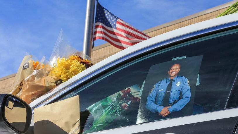 October 22, 2018 Gwinnett County: A memorial to slain Gwinnett County police officer Antwan Toney was in front of the Gwinnett County Police Annex Monday, Oct. 22, 2108 at 800 Hi Hope Rd, in Lawrenceville where flowers, note and candles are growing. JOHN SPINK/JSPINK@AJC.COM