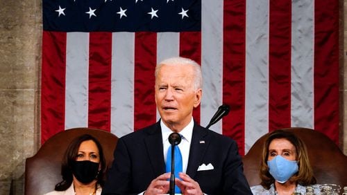 President Joe Biden, flanked by Vice President Kamala Harris, left, and Speaker of the House of Representatives Nancy Pelosi addresses a joint session of Congress at the U.S. Capitol in Washington, D.C., on Wednesday, April 28, 2021. (Melina Mara/POOL/AFP via Getty Images/TNS)